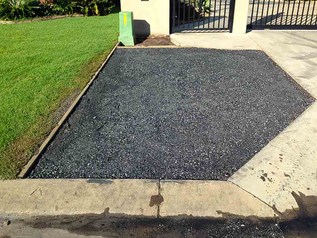 Wide finished lawn beside a house, graded by MJP Mini Diggers