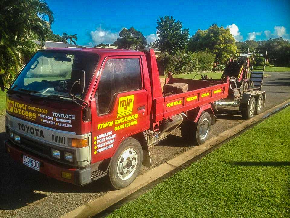 Dingo mini loader working in a Mackay backyard